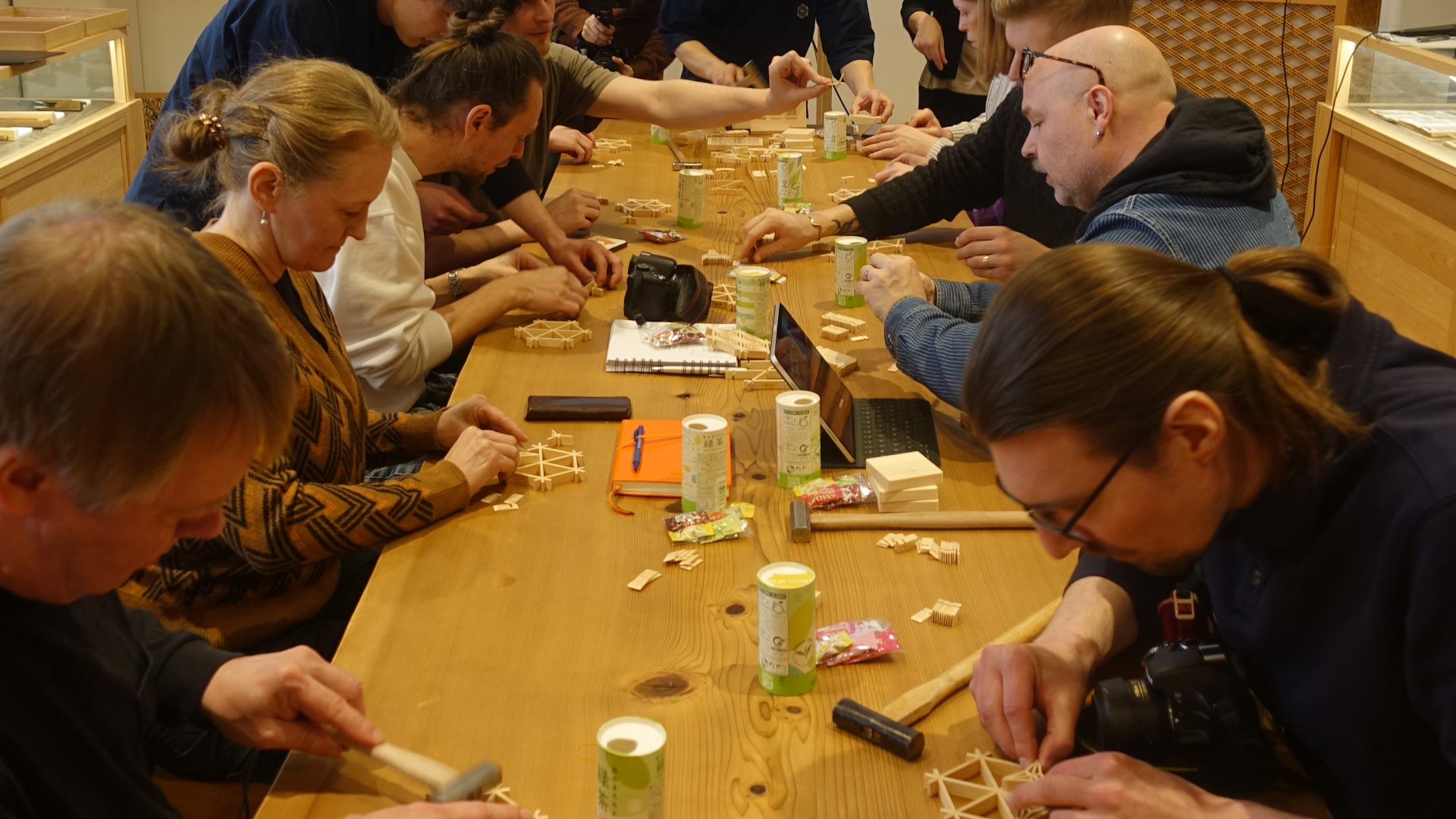 Visitors enjoying a hands-on kumiko woodworking experience